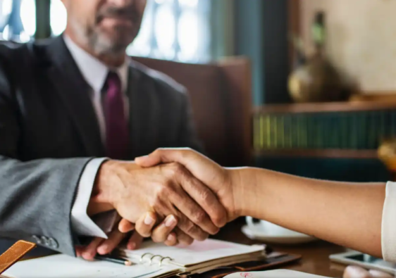 shaking hands with a lawyer